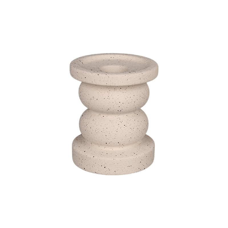 Handmade ceramic candle holder displaying structural stability and unique glaze
